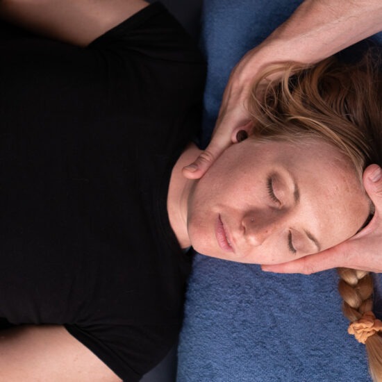 A woman getting a neck massage