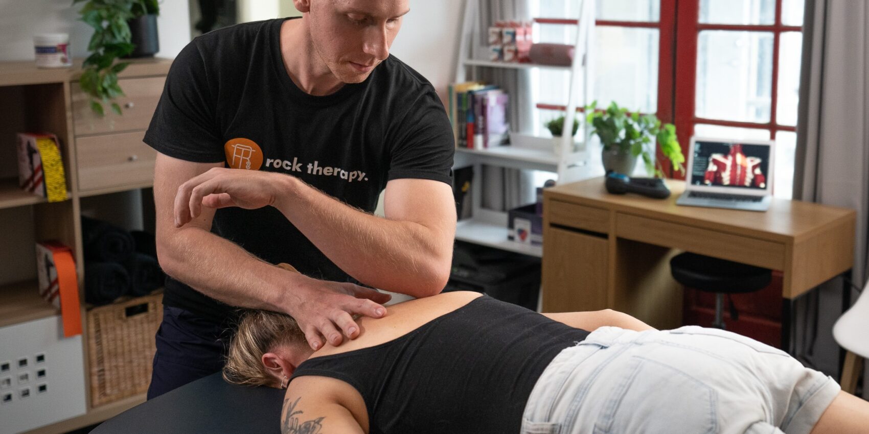 A man performing remedial massage